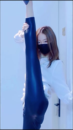 Flexible Asian Girl in Leather Pants and High Heels