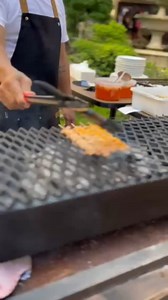 Barbecue grill under the golden light of the setting sun, surrounded by an abundance of greenery (Sunset Sessions at 19 East, 6-15-25) | 19 East