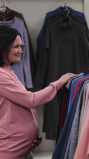clip-4016612873-pregnant-woman-belly-clothing-store-vertical-video