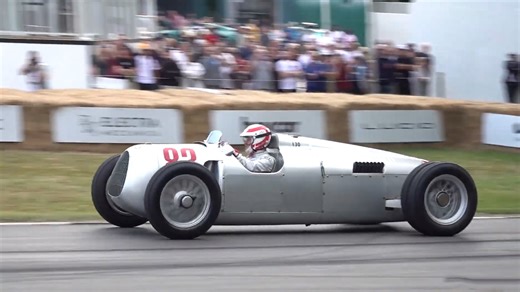 Historic Auto Union Grand Prix car full speed at hill climb track