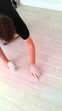 Porcelain wood look tile grout dried to light