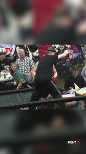 Two fighters grapple intensely against the cage wall. Raw strength and determination on full display. #MMA #Fighting #Wrestling #CageFight #Fitness | FIGHT.TV