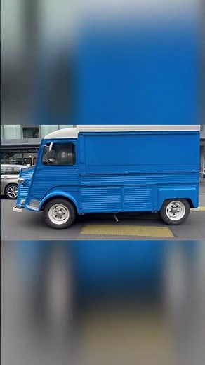 Blue Citroen Type H Driving Through the City Classic Van on the Move