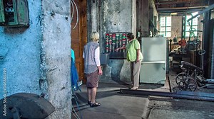 group visit a old factory with clock card machine, punch clock, time recorder