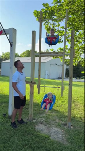 Triplets laugh and play on dad’s backyard ferris wheel