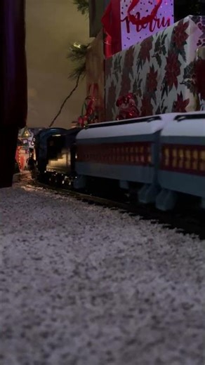 My Polar Express train set heading towards the village under my Christmas tree