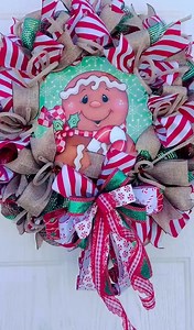 3 comments | Add a dash of holiday cheer with this adorable gingerbread-themed wreath! Featuring peppermint-striped ribbons, burlap accents, and a happy gingerbread centerpiece, it's perfect for your front door, kitchen, or mantle. A festive farmhouse touch for the season! https://meshwreathsnmore.etsy.com/listing/1798204124 | Mesh Wreaths 'N More | Facebook