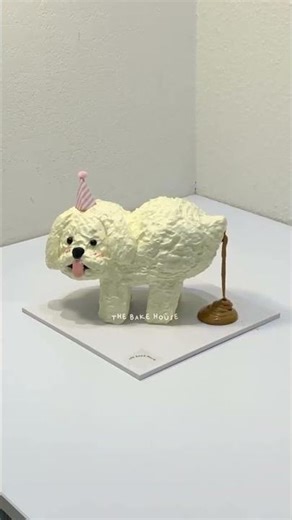 Best birthday cake ever ! 🔥🐶 This dog cake poops chocolate when lit. Credit: The Bakehouse