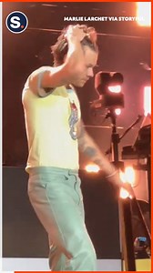 Harry Styles performed a shoey, an Australian drinking tradition that typically involves drinking alcohol from a shoe, during a concert in Perth on Monday, February 20. | storyful