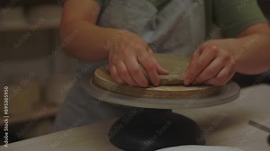 Creating ceramic products from flat sheets of clay 4k video. Building sides for clay products. Slab pottery. Using hands to model a form for a clay project.