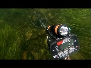 Unearthing Treasures: Exploring A Crystal Clear Riverbed With Metal Detectors