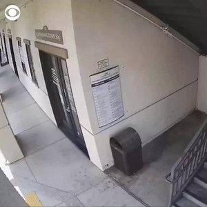 CAUGHT ON CAMERA: Surveillance video captured the moment a California man stole a purse from a woman. The woman was holding hands with her child, and both were pulled down a staircase by the man, who has been arrested, authorities say. | CBS News