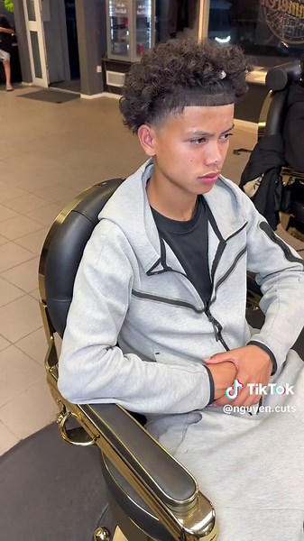 School Ready Curly Haircut with Taper Fade in Oslo, Norway