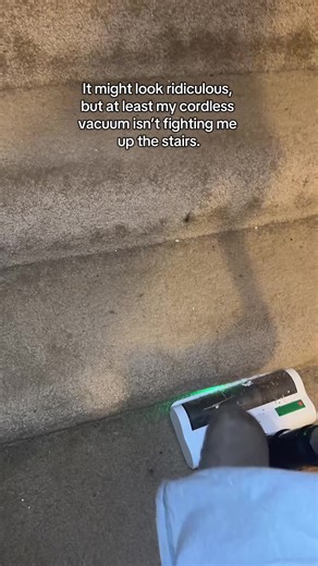 It might look ridiculous, but at least my cordless vacuum isn’t fighting me up the stairs. #corlessvacuum #homecleaning