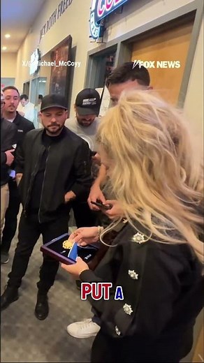 Erika Kirk shows Turning Point USA staff Charlie Kirk's Presidential Medal of Freedom #shorts #news