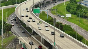 Aerial view of elevated American freeway with fast driving cars and trucks in Tampa, Florida. View from above of USA transportation infrastructure