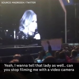 "I'm really here in real life." Adele calls out a fan for setting up a camera and tripod, and filming her concert – instead of watching the live show. | Channel 4 News