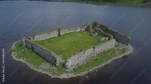 Rotating drone footage over Lochindorb Castle in Loch in Scotland