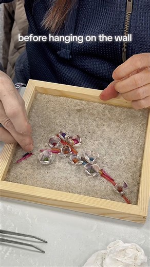 Did you know you can create beautiful shell art using self hardening sand as the background? With this simple process, you just have to push the seashells into the sand and let it dry for two days. No glue, no tape and no toxic resin. The sand retains its natural look, an easy way to dress up your coastal decor. #shellart #beachcraft #artinspo #craftideas #coastalart