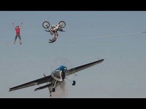 Motorcycle Backflips Over Airplane In INSANE Stunt