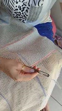 How to fix loose threads in work done on burlap with a magic needle?