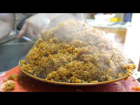 A ramen shop where ordering a "half-portion" of fried rice gets you a massive, overflowing serving.