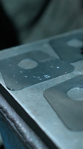 clip-4002590291-craftsman-forges-stamps-date-manufacture-on-metal