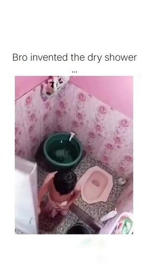 @mindclarity__1 on Instagram: "The video captures a young boy in a pink-tiled Southeast Asian-style bathroom cleverly faking a shower by scrubbing buckets and pouring water around himself while staying dry under a towel, a 23-second clip that highlights innocent mischief. Posted on January 12, 2026, by @Strictlyirene, it quickly went viral with 3.1 million views and 19,600 likes, sparking 400 replies where users confess to similar childhood tricks like “ghost showers” to skip bathing. Such conte