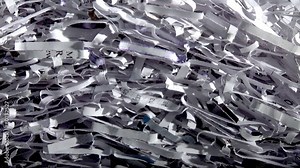 Papers scraps falling from a shredder fill up the screen. Three clips with transition sped up to create different screen-fill rates. First transition actually takes one second from black to full screen. Second is three seconds. Third is five seconds.