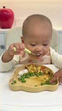 18-month-old baby eating rice self-feeding cute baby foodie