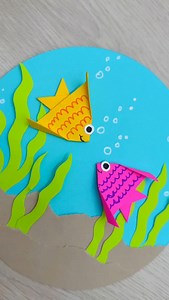 Two little paper fish, swimming into a sea of cuteness 🐟💛💖 Made with simple folds, bright paper, and a lot of happy vibes. This under the sea scene was such a joy to put together, easy, playful, and perfect for a quick creative break. Sometimes paper crafts really do feel like magic ✨🌊 #paperfish #fishtank #papercrafts | Craftish Corner