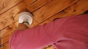Changing a ceiling light bulb