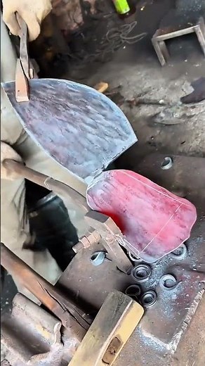 Blacksmith Forging Hammering a Red-Hot Steel Blade on an Anvil