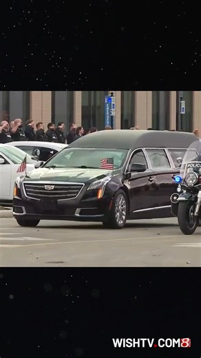 Ofc. Brian Elliott received his escort to a Beech Grove funeral home Wednesday morning, several law enforcement officers gathering at the coroner's office to salute Elliott as he passed by. | WISH-TV
