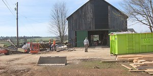 Thoroughbred retirement farm building new visitor center inside old barn