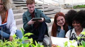 Vertical 4k video of young students sharing notes and preparing the exam together. Concept: teamwork, sharing