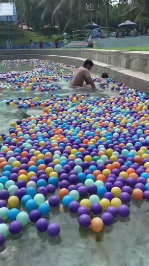Play swimmimg in big swimming poll ball pit