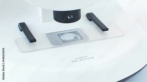 Researcher Hands Putting the Feather in White Microscope for Scientific Experiment