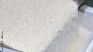 Rice factory. Cleaning and production of rice. Conveyor for packing rice and cereals.