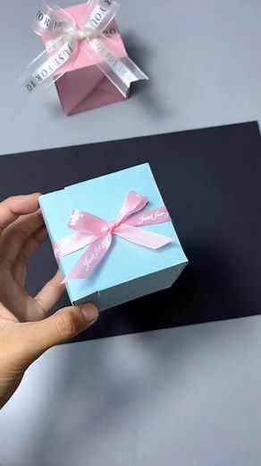 48K views · 2.9K reactions | Create a simple gift box using two sheets of paper. Fold into three equal parts horizontally and vertically. Fold corners downward and along diagonals, mirroring on the other side. Follow creases to shape the box. | Paper Craft Ideas | Facebook
