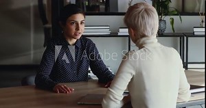 Happy successful indian candidate getting hired after good job interview handshaking female employer. Hr manager employing applicant, selling insurance to client, shaking hand of new company recruit. Stock Video