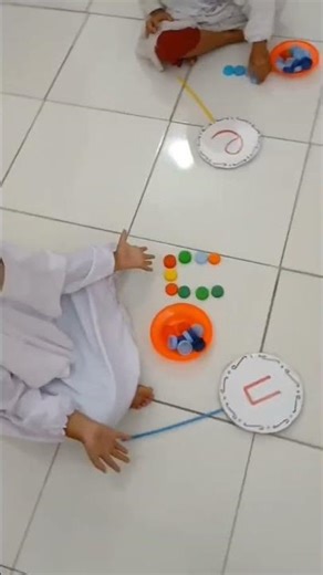 Letter writing activity using bottle caps #writing #paud #fyp