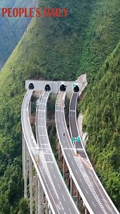 The tunnels and expressway bridges wind through mountains in southwest China’s #Guizhou Province, like ribbons hanging on the mountains. | People's Daily, China