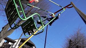 Boy and girl ride on a swing. Slow-motion shooting of 960 frames per second Stock Video