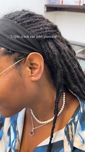 A stacked earlobe piercing refers to a curated arrangement of multiple piercings on the earlobe, typically placed close together or in a deliberate pattern to create a layered, stacked aesthetic. Unlike standard single or double lobe piercings, stacked piercings involve three or more holes, often adorned with a mix of studs, small hoops, or delicate jewelry to achieve a cohesive, stylish look.#Piercing #piercer #piercingartist #stacked #lobe #lobepiercing | Backstage Palisades Mall | Facebook