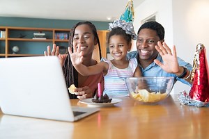 Free Photo | Portrait of a family celebrating birthday online on a video call with laptop while staying at home. New normal lifestyle concept.