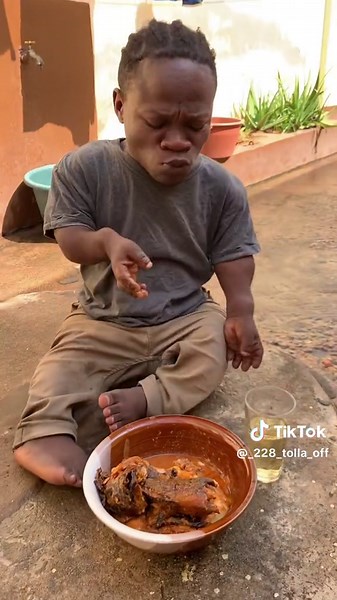 Young Boy Enjoys Meal Outdoors