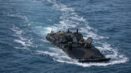 US Marines launch amphibious vehicles from warship