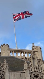 British national flag waving on building of Parliament of the United Kingdom. Flag of Great Britain is one of state symbols of state of the UK of Great Britain and Northern Ireland. Vertical video