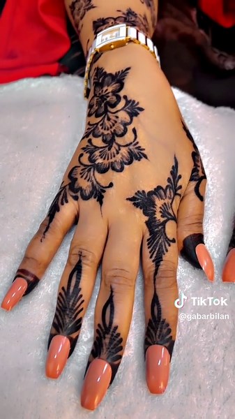 Intricate Black Henna Designs on Elegant Hands